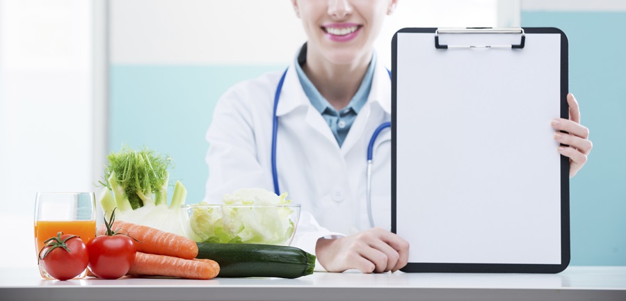 doctor with vegetables and checklist